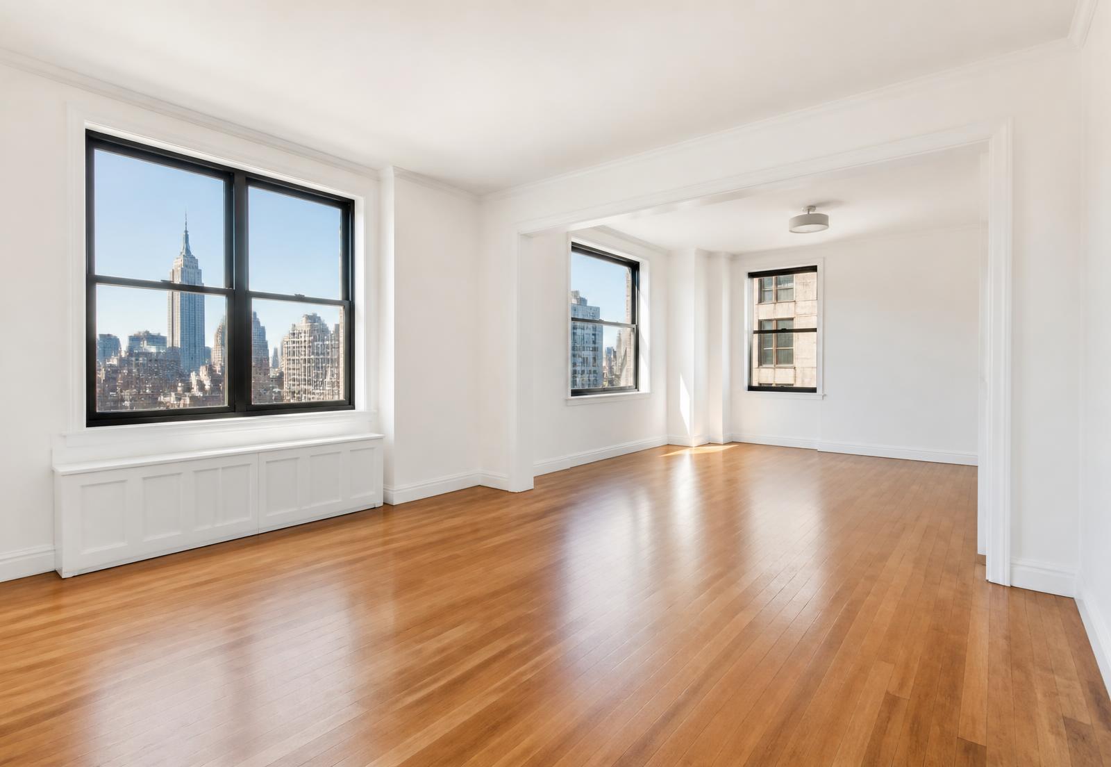 Sunlit New York City apartment with hardwood floors and large windows